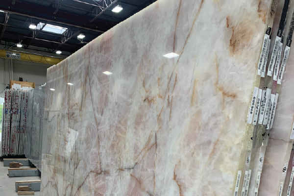 Shopping with a client for wall and countertop slabs for kitchen, bathrooms, fireplaces, and rugs