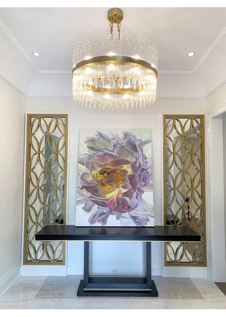 Inviting entry way with custom lighting and artwork
