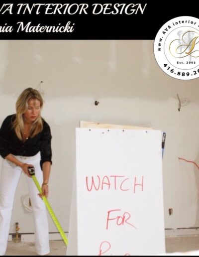Ania at the interior design job site measuring for accuracy.